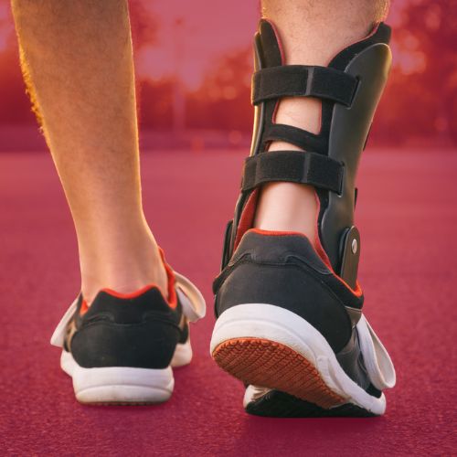 Ankle brace support worn during walking for stability and injury recovery